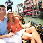 Couple in Venice having a Gondola ride on canal grande